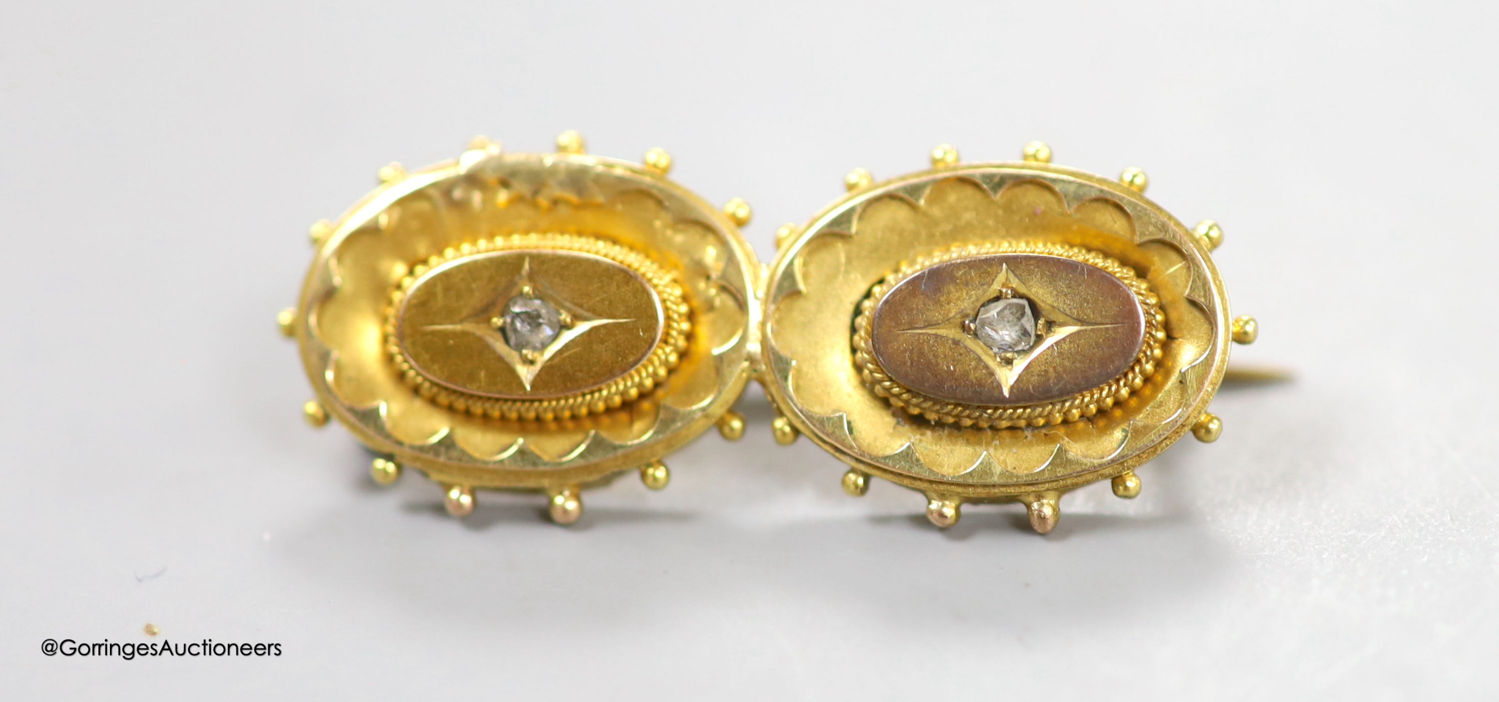 A Victorian yellow metal and rose cut diamond set 'double oval' brooch (adapted stick pins), 34mm, gross weight 3.9 grams.